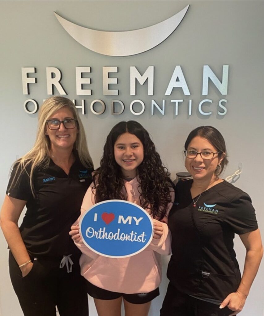 Girl that just got braces on with Freeman Orthodontics